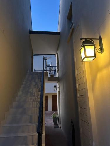 a stairway with a light on the side of a building at Mountain View 1-Bedroom Villa in Franschhoek in Franschhoek