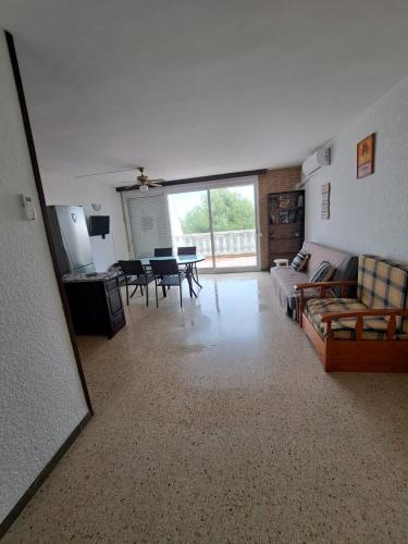 a living room with a couch and a table at Apartamento Aventura in Salou