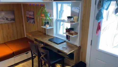 a desk in a room with a window at The Notch Hostel in North Woodstock