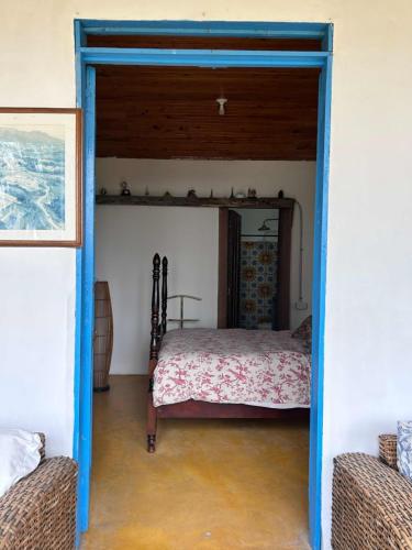 a bedroom with a bed in the middle of a room at Buriti EcoH RNT56521, via Termales Santa Rosa de Cabal in Santa Rosa de Cabal