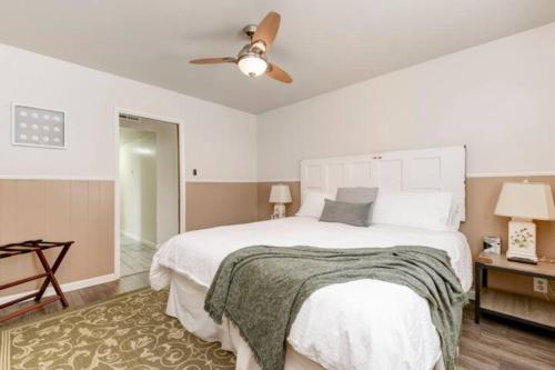 a white bedroom with a bed and a ceiling fan at Perla D'Italia -1BR- FREE Driveway Parking -1 Car in San Diego