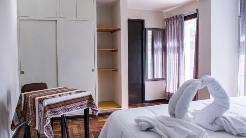 Cama o camas de una habitación en Esmeralda Suites Cusco