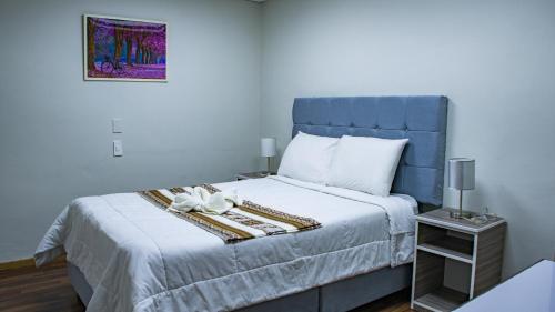 Cama o camas de una habitación en Esmeralda Suites Cusco