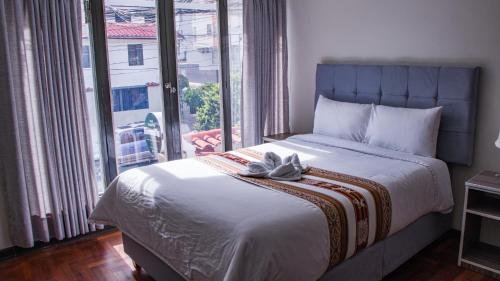 Cama o camas de una habitación en Esmeralda Suites Cusco