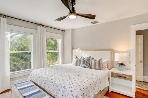 a bedroom with a bed and a ceiling fan at Lush West Palm Beach Getaway with Backyard Oasis! in West Palm Beach