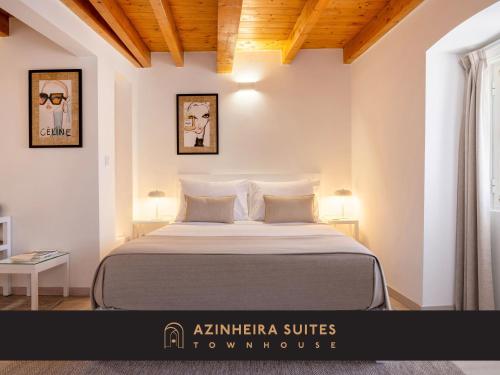 a bedroom with a large bed in a room at Azinheira Suites Townhouse - Alojamento Turístico in Elvas