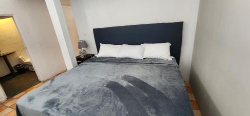 a bedroom with a large bed in a room at Hotel Tao in Atlixco