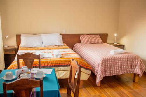 Ένα ή περισσότερα κρεβάτια σε δωμάτιο στο Allin Illary Eco Hospedaje