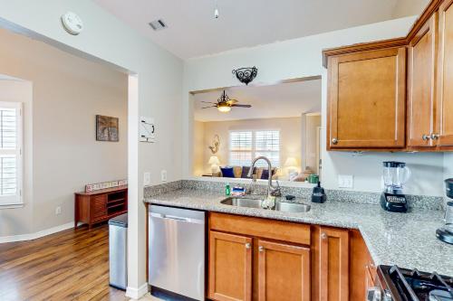 a kitchen with a sink and a counter top at Unforgettable Haven in Niceville