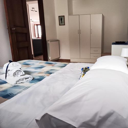 a large bed in a room with at Villa Genesia in Bacoli