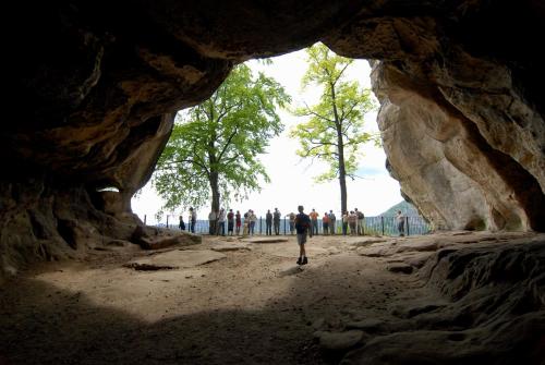a group of people standing inside of a cave at Pension Zumpe in Stolpen