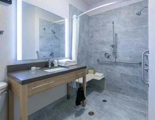 a bathroom with a sink and a shower at Candlewood Suites Fort Worth West by IHG in Fort Worth