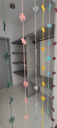 a group of hanging ropes in a room at Pontal Praia Suítes in Fortim