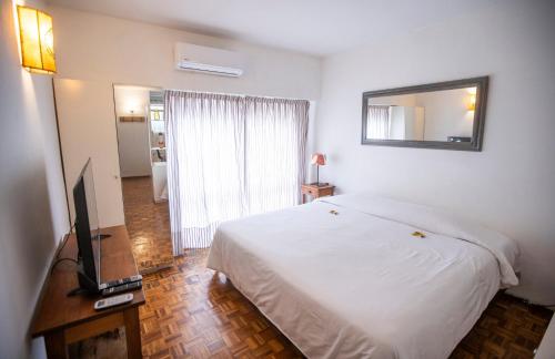 מיטה או מיטות בחדר ב-Cozy Apartment in the heart of Recoleta