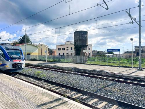 a train on the tracks near a train station at Dolce Apartments Albano in Albano Laziale