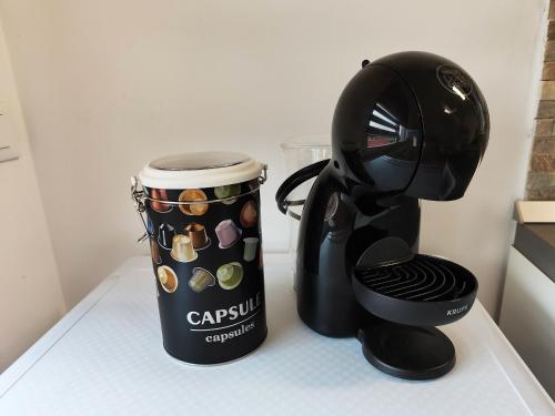 a coffee maker and a coffee cup on a counter at Bastia Home Appartamento in Bastia Umbra