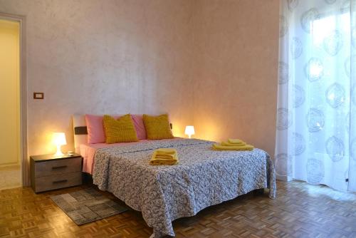 Ένα ή περισσότερα κρεβάτια σε δωμάτιο στο Appartamento Ginestra