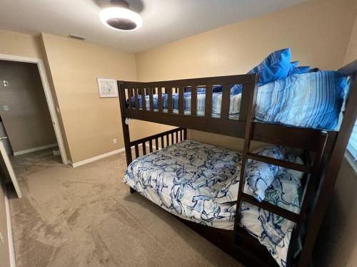 a bedroom with two bunk beds in a room at Tropical Pool & Patio Bar minutes to the beach! in Seminole