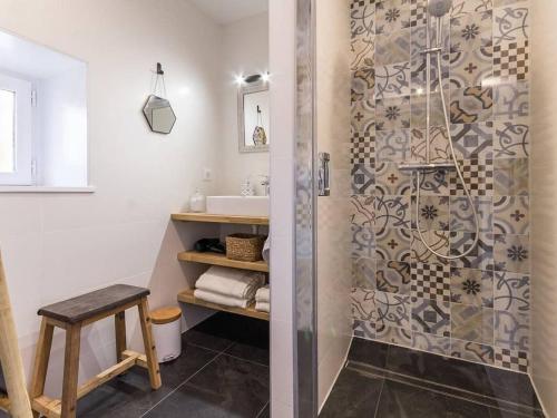 a bathroom with a shower and a sink at Chaumière rénovée avec jardin clos, proche de Guérande et des plages, idéale pour familles - FR-1-306-860 in Saint-Lyphard
