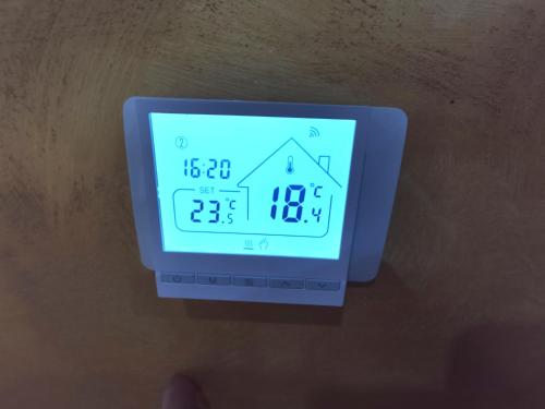 an alarm clock with a house on the screen at LA TORRETTA apartment suite in Anagni