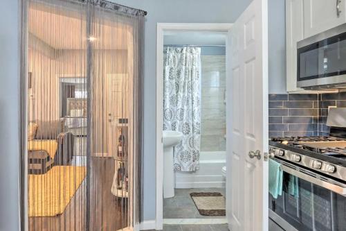 a kitchen with a bathroom with a shower backdoor at Luxury Home in Linden
