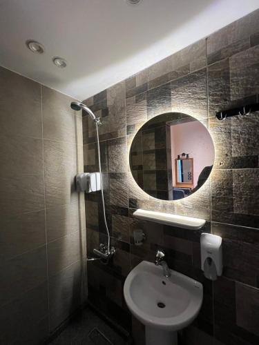 a bathroom with a sink and a mirror at Space Hostel in Cairo