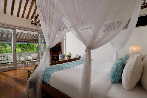 Tempat tidur dalam kamar di Villa Hasian Jimbaran