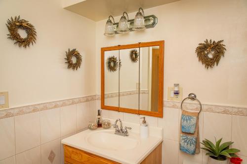 a bathroom with a sink and a mirror at Spacious Comfy Room in Cozy Classy Duplex in Brooklyn