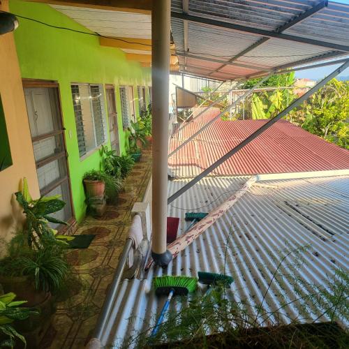 an outside view of a house with a roof at Hostal Doña Gladys in Flores