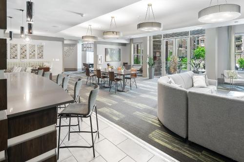 a living room with a couch and a table at Uptown 4th Ward Luxury Apt Year-Round Pool in Charlotte