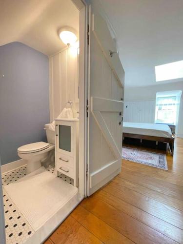 a white bathroom with a toilet and a sink at Society Hill, Historical Luxury Home, 3Bd/2.5Ba in Philadelphia