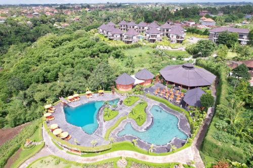 an aerial view of a resort with a swimming pool at Swan Paradise A Pramana Experience in Gianyar