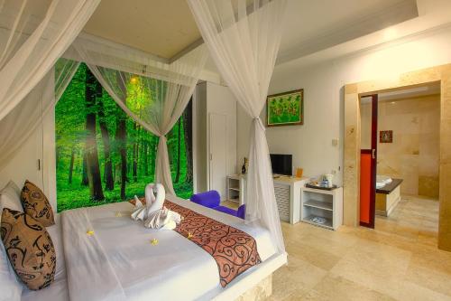 One Bedroom Private Villa Kuta في سمينياك: غرفة نوم فيها سرير عليه اثنين من الأرانب