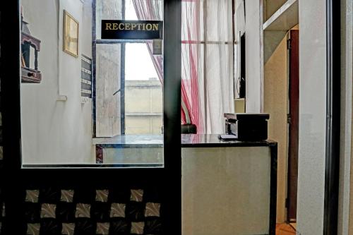 a room with a sign that reads reception at Super Hotel O Krishna Guest House & PG in Ludhiana