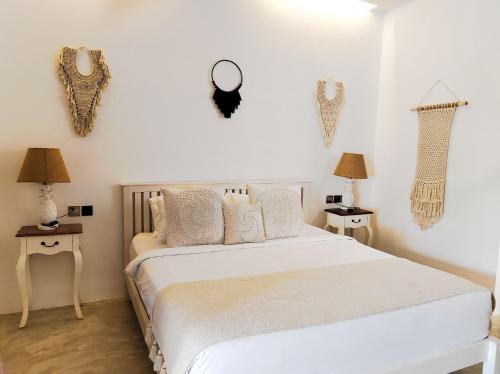 Ένα ή περισσότερα κρεβάτια σε δωμάτιο στο Omahati Villa Brawa