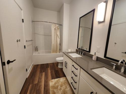a bathroom with a sink and a toilet and a tub at Château at Lake Austin - 10 Min Walk to Center DT in Austin