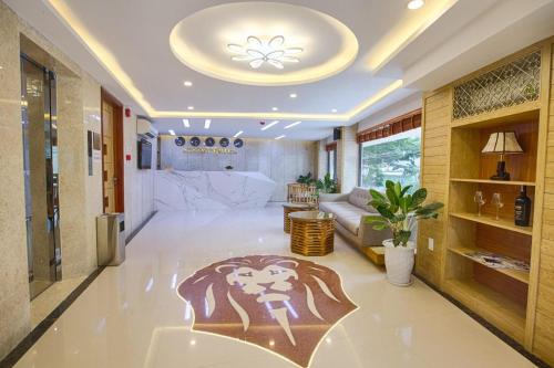 a living room with a lion rug on the floor at Alyssa Hotel Da Nang in Da Nang