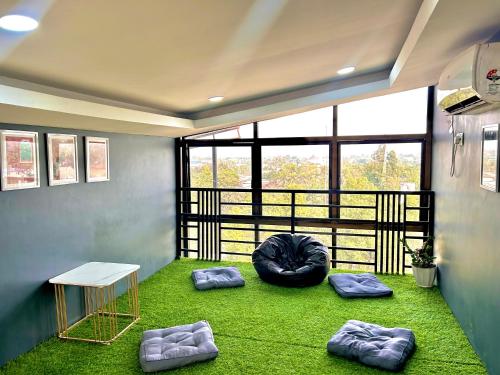 a room with two bean bags on the grass at The Loft House in Dimāpur