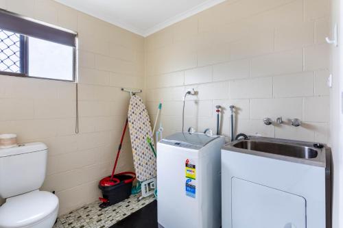 a bathroom with a sink and a toilet at Driftwood on the Beach in Yeppoon