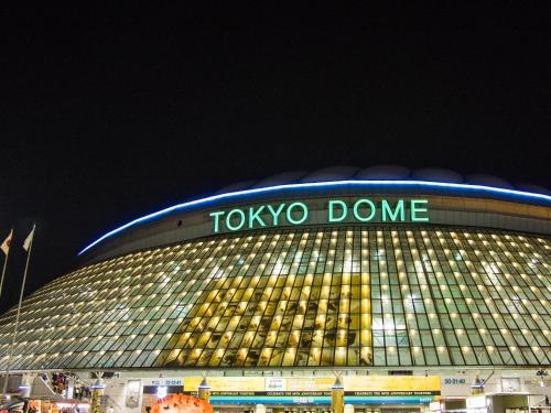 a tokyo dome at night with a sign on it at APA Hotel Iidabashi Ekimae in Tokyo