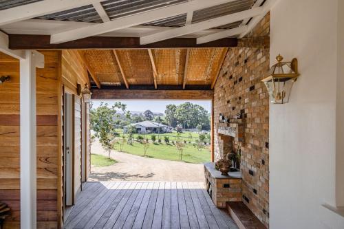 an open door to a patio with a view at Eagles Nest Milton in Milton