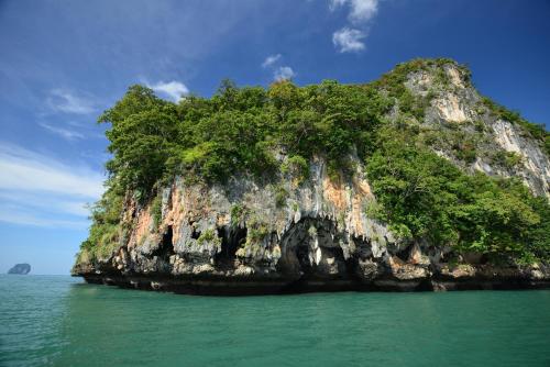 a small island in the water in the ocean at Bhu Nga Thani Resort & Villas Railay in Railay Beach