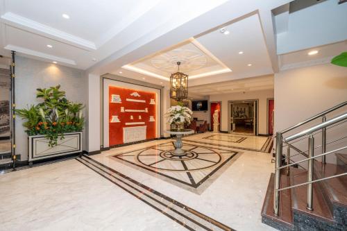 a lobby with a table in the middle of a building at The Byzantium Suites Hotel & Spa in Istanbul