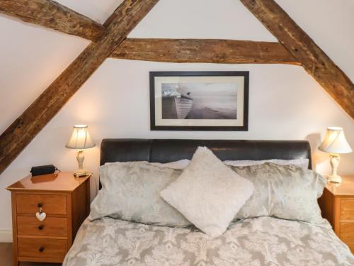 a bedroom with a bed and two night stands at Sea Shanty in Whitby