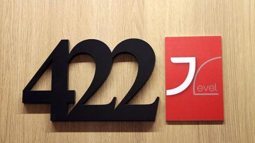 a black amazon sign next to a red sign at Mjus Resort & Thermal Park in Körmend