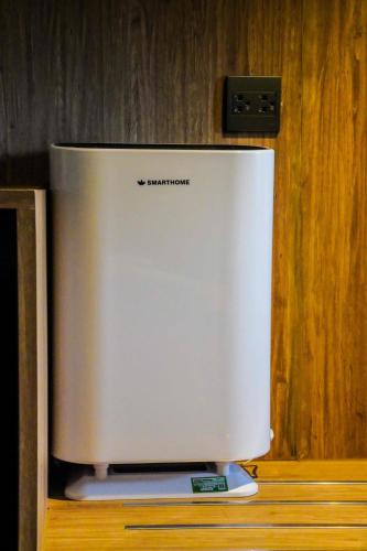a white appliance sitting on top of a counter at Moose Hotel Nimman in Chiang Mai