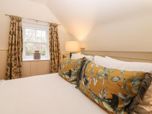 a bedroom with a bed and a window at North Mains Cottage - Craigievar Castle in Alford