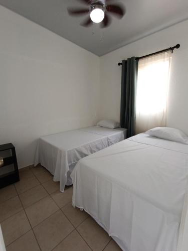 Ένα ή περισσότερα κρεβάτια σε δωμάτιο στο MINI CASA ECOTERRA SANTA ANA