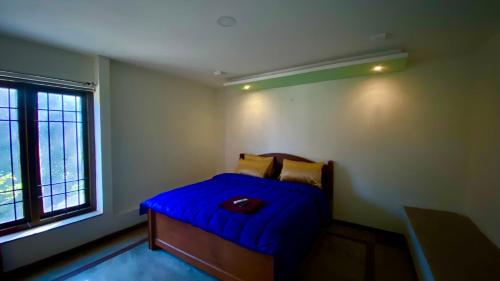 Letto o letti in una camera di Willostays Alpine Mansion 6bhk