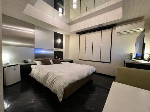 Ένα ή περισσότερα κρεβάτια σε δωμάτιο στο HOTEL SOLA Yame-ADULT ONLY-